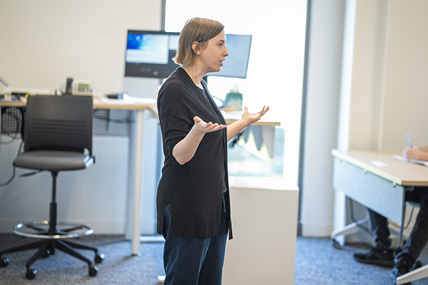 Amy Perry leads a classroom discussion with STLCC students.
