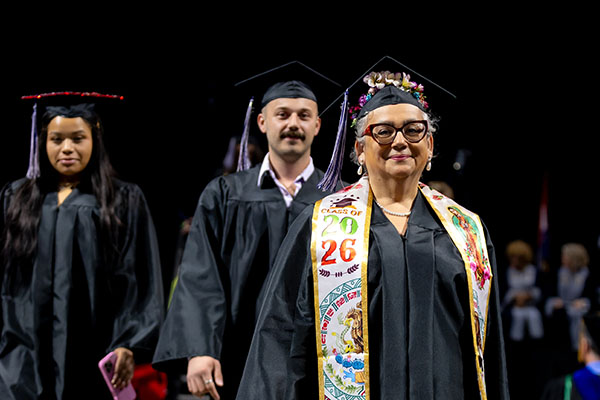 STLCC graduates walk aross the stage during the 2026 commencement ceremony at STLCC width=