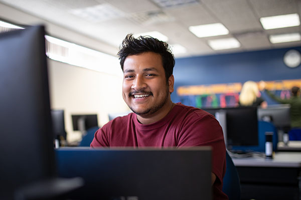 STLCC student in front of computer