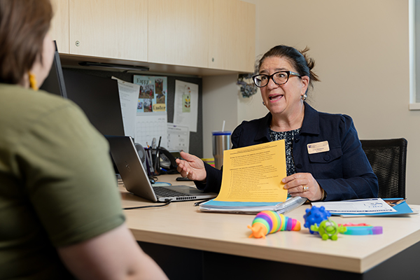 An access office specialist meeting with a student