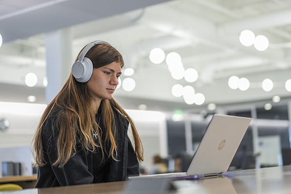 student using AI on laptop