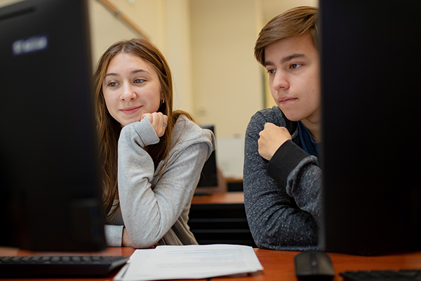 students working on laptop