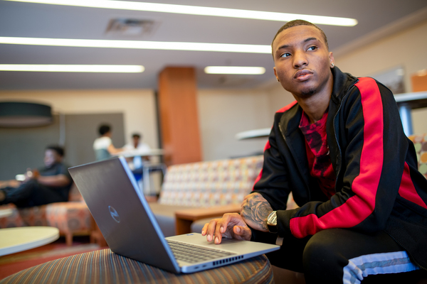 STLCC student on laptop wondering how to get started with ai