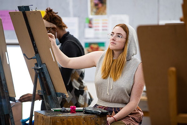 STLCC student in figure drawing class width=