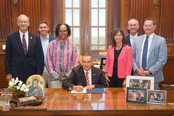 Missouri Gov. Mike Kehoe signing the Transfer Act width=