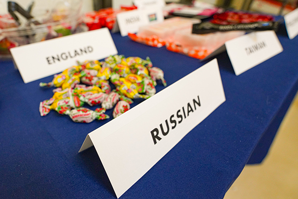 Assorted international foods displayed on a table, representing multiple cultures