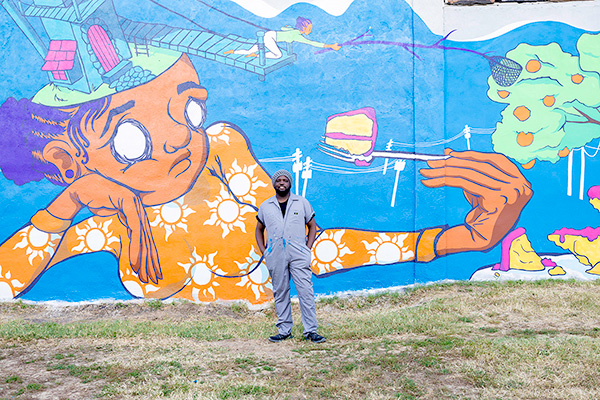 Brian Lathan and his mural