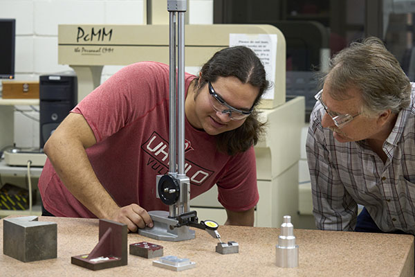 STLCC student participating in hands-on manufacturing course width=