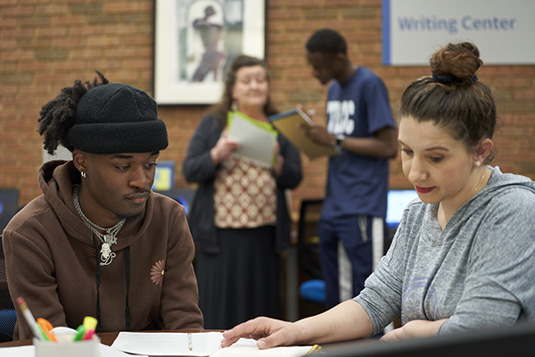 A student receiving one-on-one academic support from a tutor.