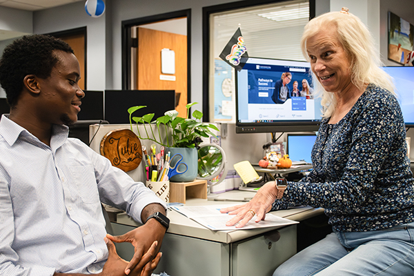 STLCC student meeting with academic advisor to discuss scholarships and classes