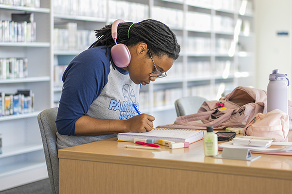 STLCC student studying for finals in the Meramec library
