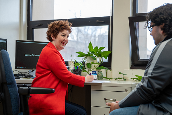 STLCC academic advisor guiding a community college student through university transfer planning STLCC academic advisor guiding a community college student through university transfer planning