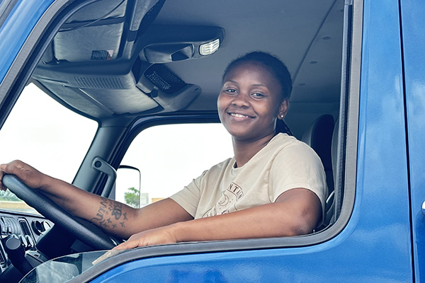 An STLCC truck driving students sits behind the wheel of a big rig