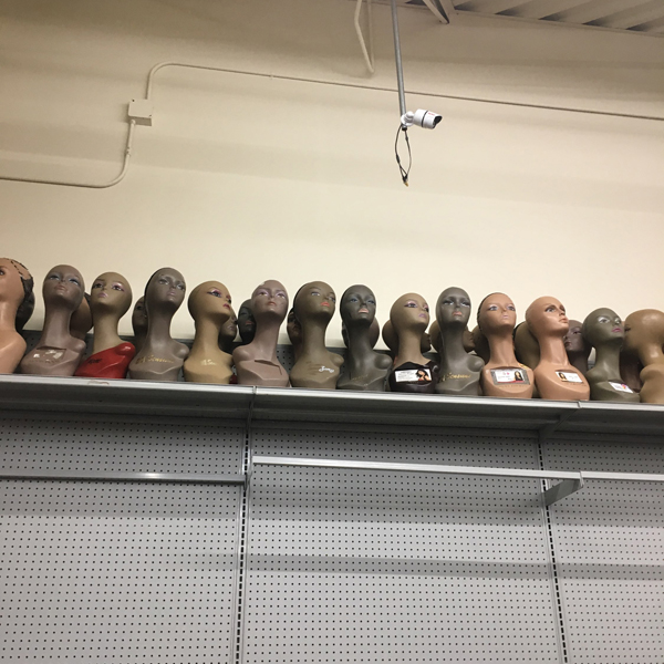 Sample artist work: a row of female busts on a shelf