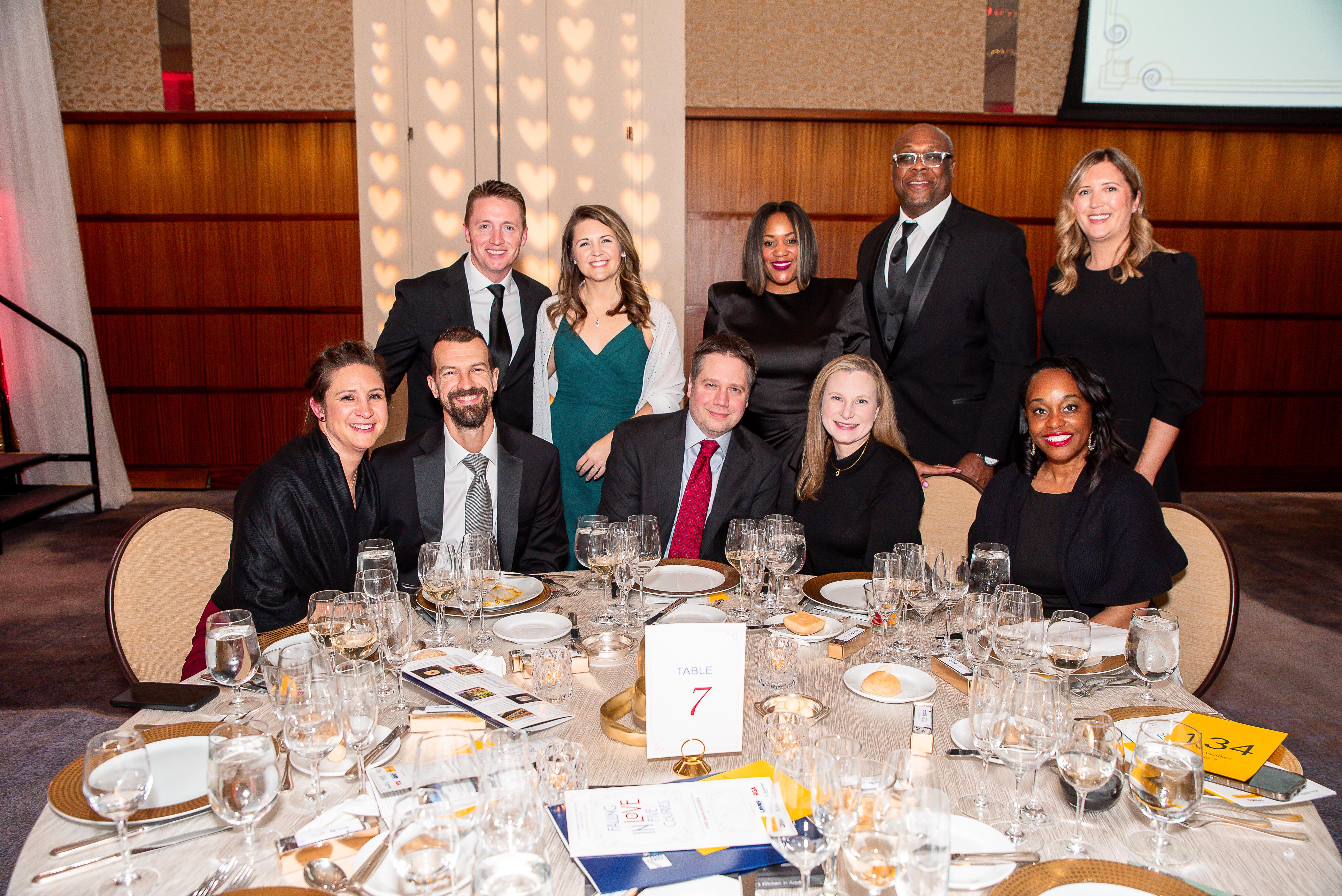 A group of guests seated around a gala table