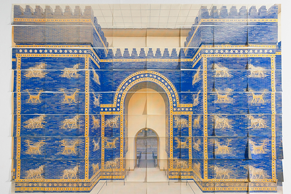 Blue and gold gate depicted across overlapping sheets of paper, with a central archway and rows of animal figures