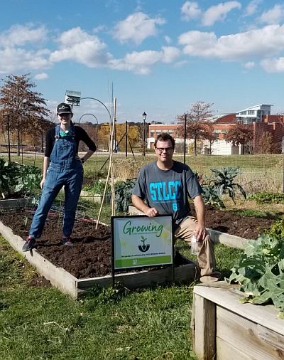 two students in the garden plot at STLCC.wildwood