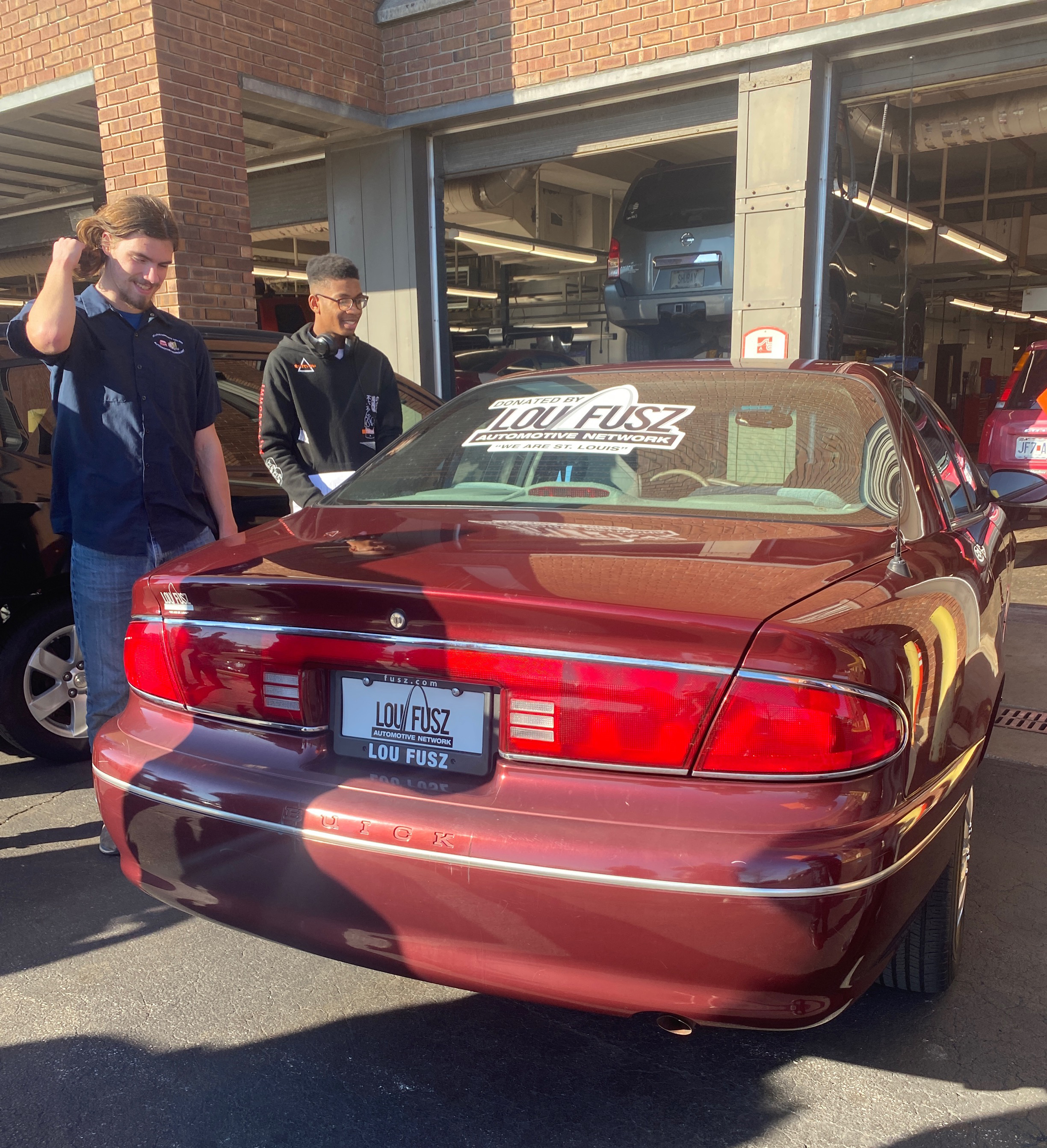 Students check donated cars