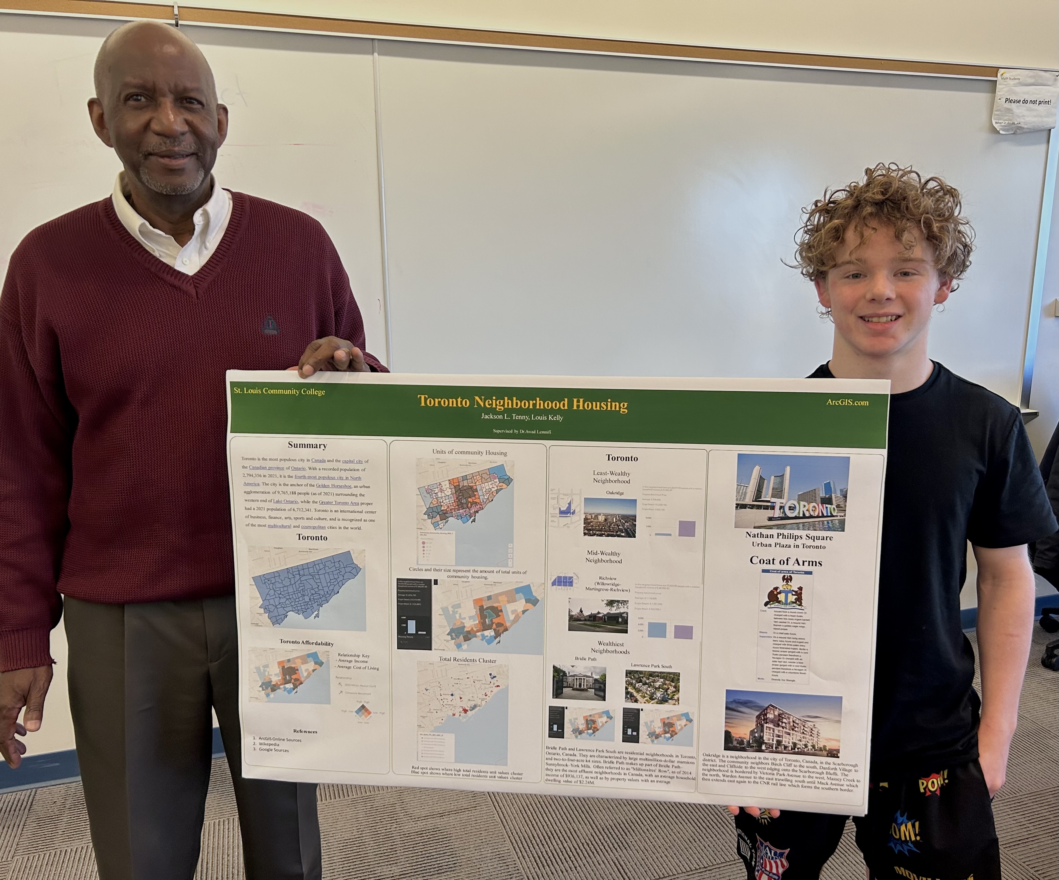 Professor with student displaying GIS project