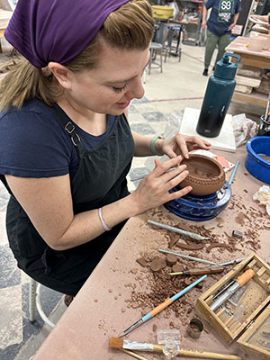 Kayla Bailey making bonsai pot