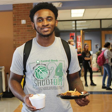 STLCC student Brian Lee enjoys National Hispanic Heritage Month tasting