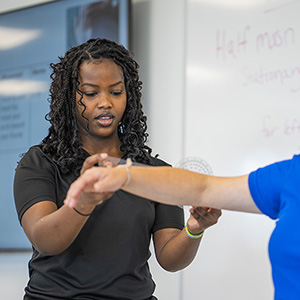 Sabato practicing occupational therapy skills in the classroom
