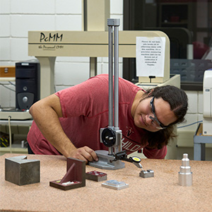 Student engaged in hands-on machine training