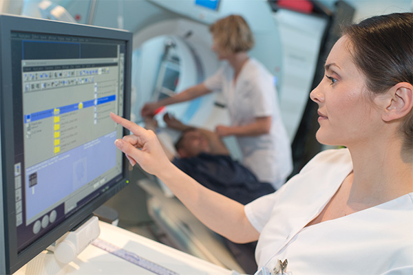 Student accessing medical records on a computer screen