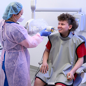 Dental student providing care to patient