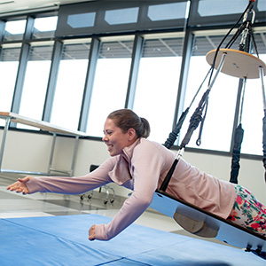 Student practicing on occupational therapy equipment