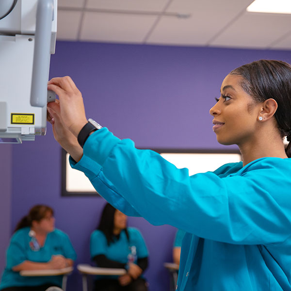 Student practicing with Xray technology