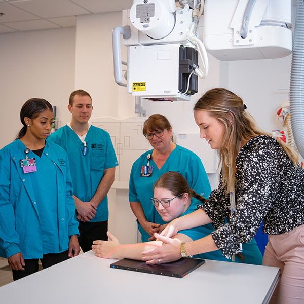 Radiologic technology instructor giving demonstration