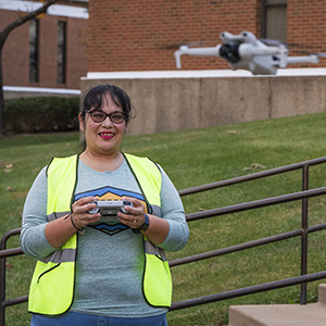 Female student operating a drone