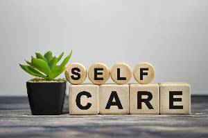 wooden blocks spelling "self-care"