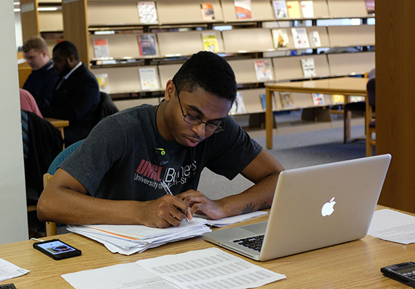 UMSL student studying in the library