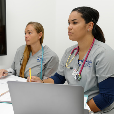 two female nursing students in a classroom
