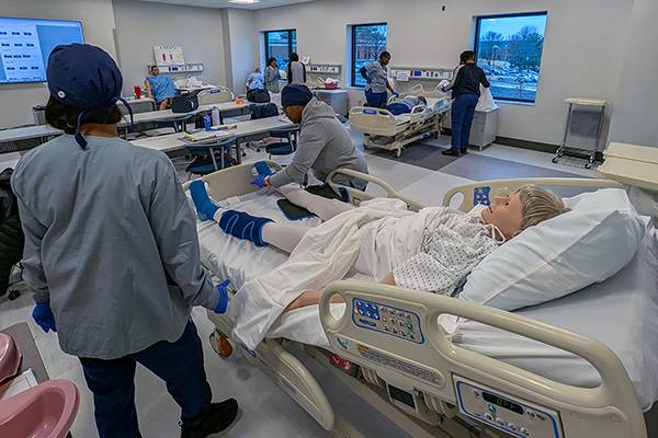 nursing students practice in the new skills lab