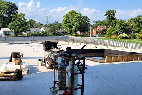 Green roof progress with railing and waterproofing