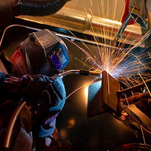 Student using welding torch