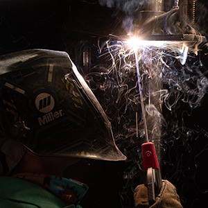 Student wearing welding mask